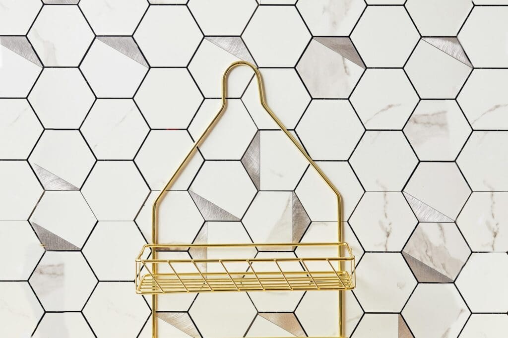 Honeycomb bathroom tile with golden shower cabby