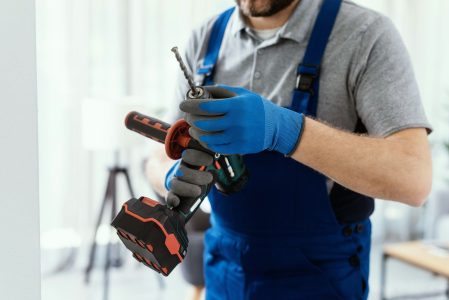 Professional handyman using a drill