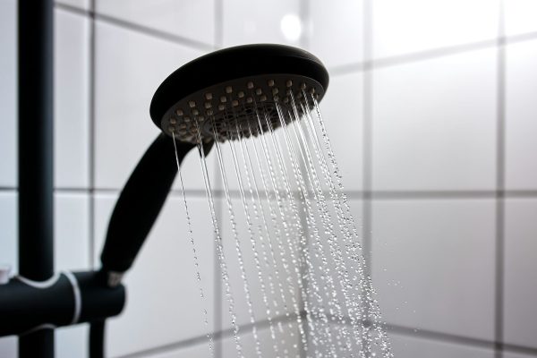 Water from the shower in the modern bathroom